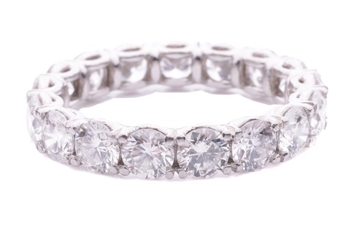 Lot 103 - A diamond eternity ring set with round...