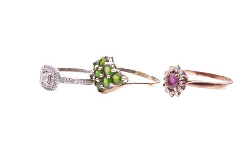 Lot 184 - Three gem-set rings including a peridot...
