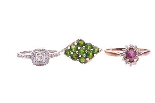 Lot 184 - Three gem-set rings including a peridot...
