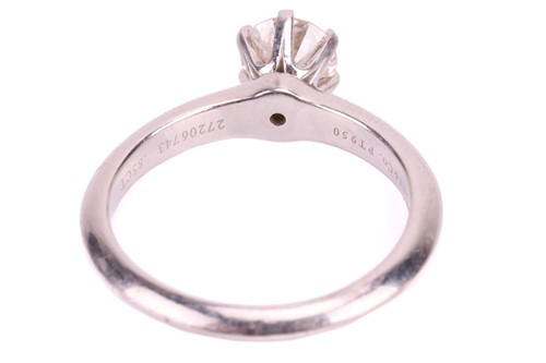 Lot 32 - A Tiffany & Co. diamond solitaire ring, set...
