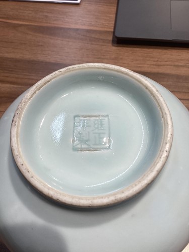 Lot 63 - A Chinese powder blue ground circular saucer...