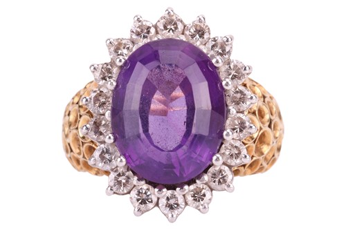 Lot 105 - An amethyst and diamond set cluster ring. The...