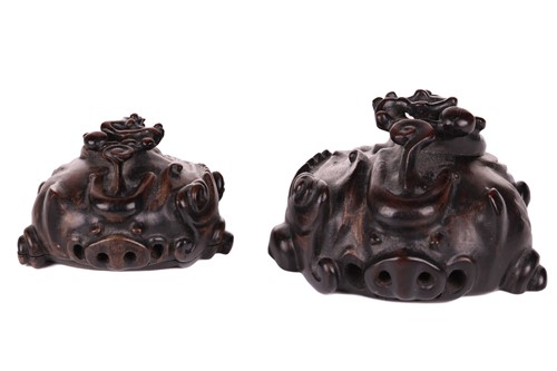 Lot 60 - A Chinese carved wood-lidded box in the form...