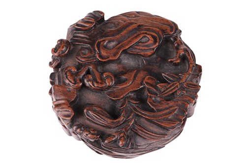 Lot 60 - A Chinese carved wood-lidded box in the form...