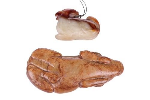 Lot 7 - A Chinese carved jade figure of a recumbent...
