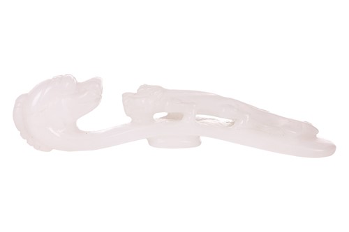 Lot 38 - A Chinese carved white jade fibular belt hook,...