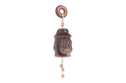 Lot 37 - A Chinese carved dark green jade and yellow...