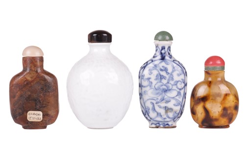 Lot 24 - A Chinese brown variegated jade snuff flask...