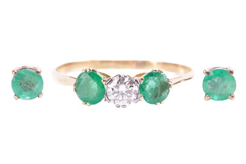 Lot 84 - A three stone emerald and diamond half hoop...
