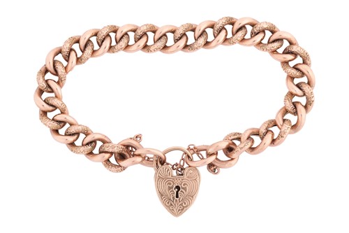 Lot 56 - A 9-carat rose gold curb pattern bracelet with...
