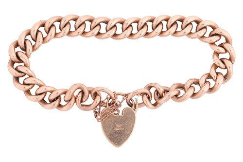 Lot 56 - A 9-carat rose gold curb pattern bracelet with...