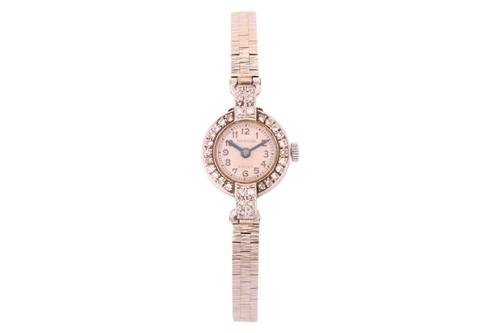 Lot 223 - A diamond set cocktail watch, the circular...