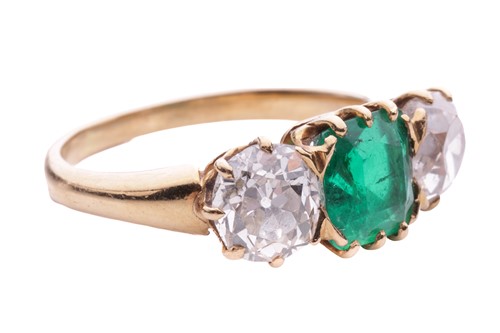 Lot 152 - An emerald and diamond three stone ring, the...