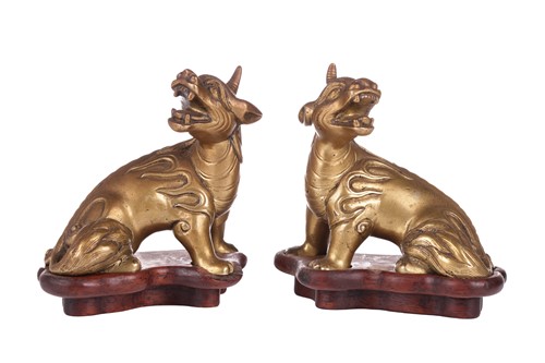 Lot 49 - A pair of Chinese, gilt bronze scholar's...