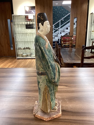 Lot 12 - A Chinese tomb figure of an official, Ming...