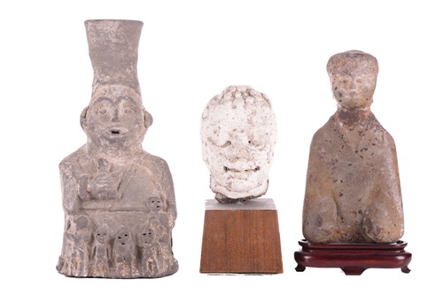 Lot 13 - An Oriental carved sandstone head of a...