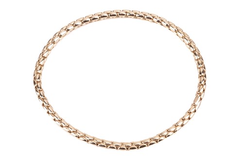 Lot 120 - An 18ct yellow gold stretch bracelet by...