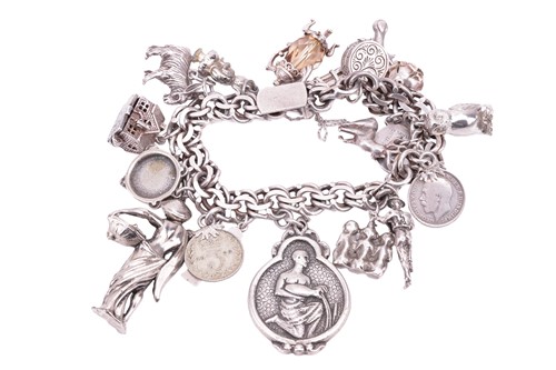 Lot 147 - A silver charm bracelet with eighteen assorted...
