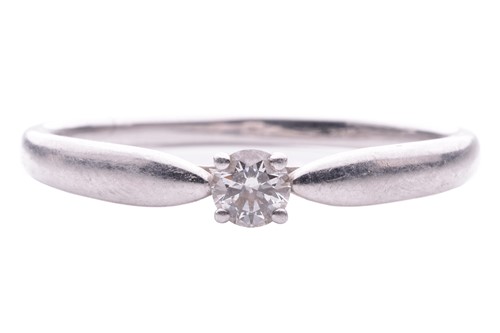 Lot 103 - Tiffany & Co. - a diamond solitaire ring in...