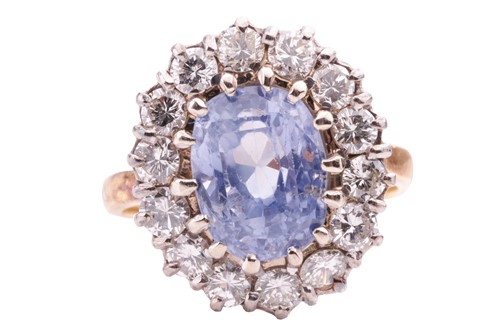 Lot 126 - A sapphire and diamond entourage ring,...