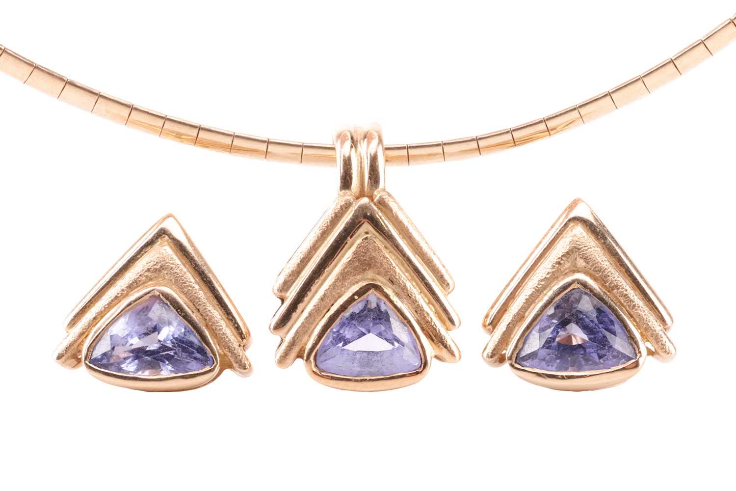 Lot 57 - A tanzanite pendant and earrings suite,...