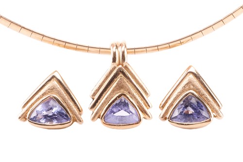 Lot 57 - A tanzanite pendant and earrings suite,...