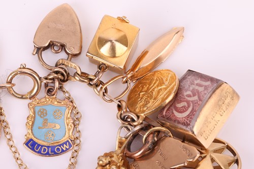 Lot 52 - A charm bracelet in 9ct gold, with a variety...