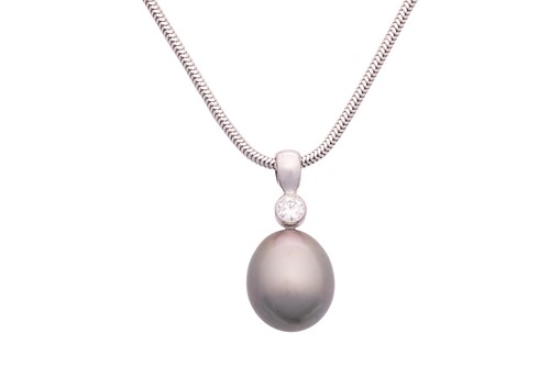 Lot 23 - A cultured Tahitian pearl and diamond pendant...