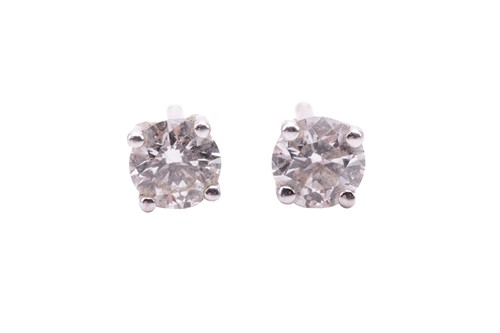 Lot 42 - A pair of diamond stud earrings with...