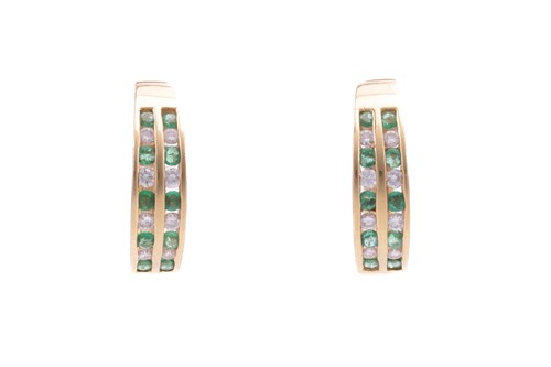 Lot 17 - Two pairs of gem-set hoop earrings; the first...