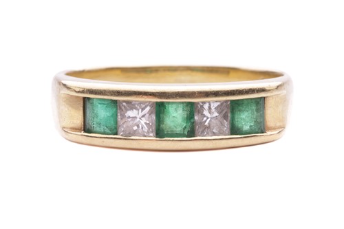 Lot 148 - An emerald and diamond half-hoop ring, channel-...