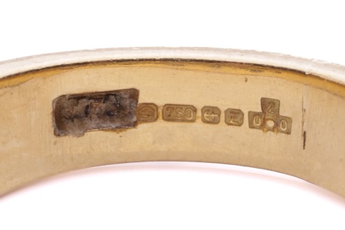 Lot 56 - An emerald and diamond-set ring, featuring...