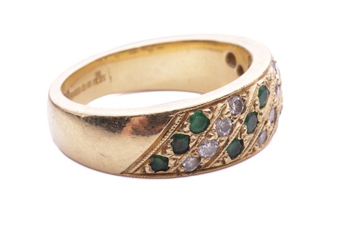 Lot 56 - An emerald and diamond-set ring, featuring...