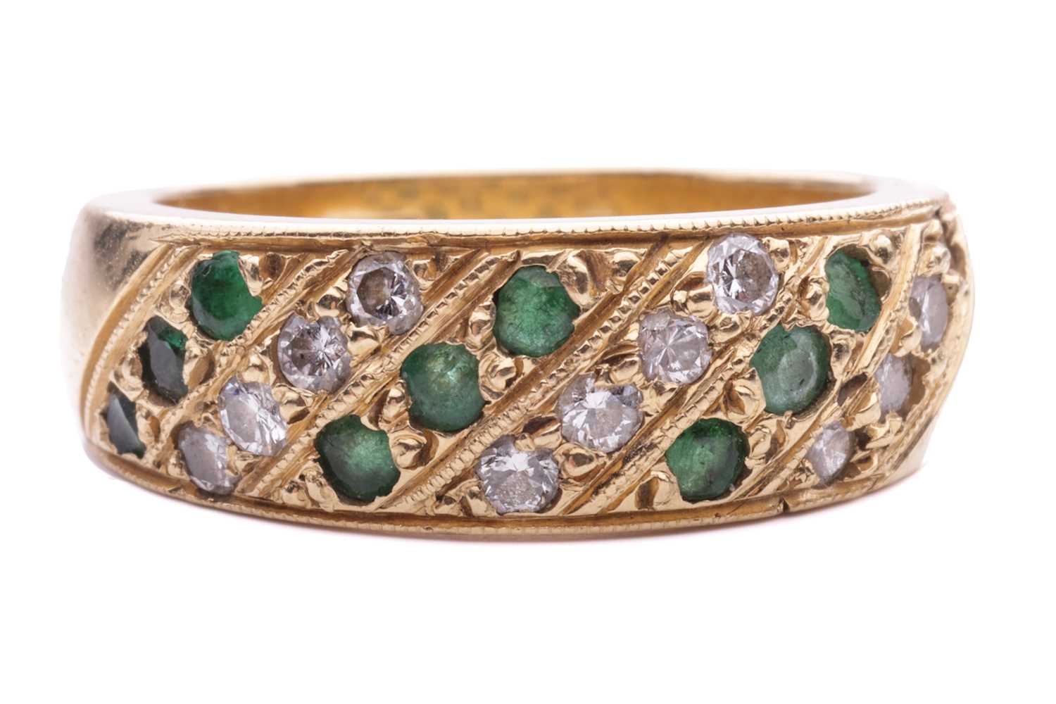 Lot 56 - An emerald and diamond-set ring, featuring...