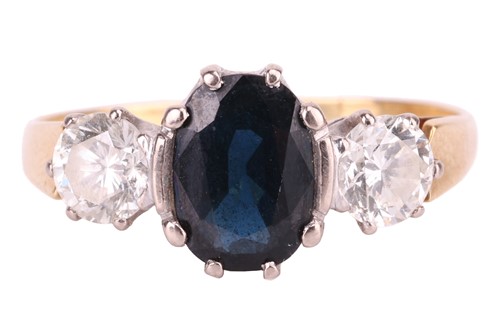 Lot 179 - A sapphire and diamond three-stone ring,...