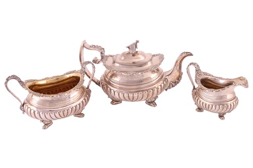Lot 314 - A George III silver three-piece tea service,...