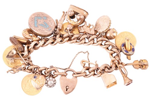 Lot 48 - A 9ct gold charm bracelet, suspending 22...
