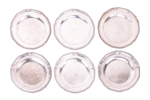 Lot 334 - A set of six silver dinner plates, by...