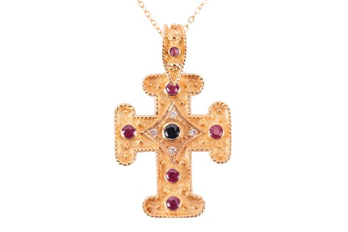 Lot 45 - A gem-set cross pendant on chain, containing...