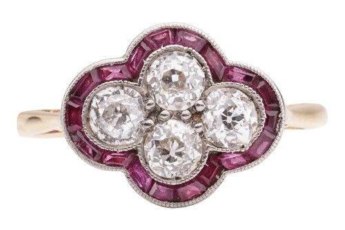 Lot 30 - An Art Deco diamond and ruby quatrefoil ring,...