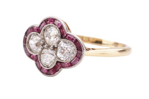 Lot 30 - An Art Deco diamond and ruby quatrefoil ring,...