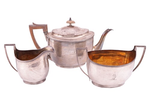 Lot 204 - A George III silver matched three-piece tea...