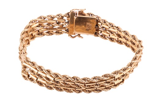 Lot 142 - A textured chain bracelet, comprised of five...