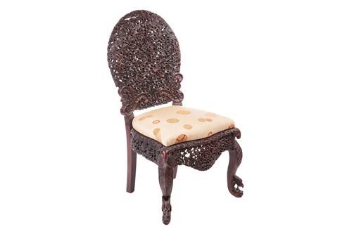 Lot 134 - An Indian 'Bombay Carved' padauk slipper chair...