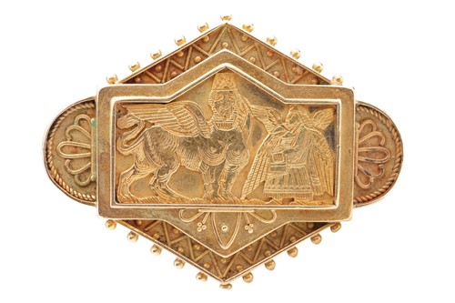 Lot 128 - An Assyrian Revival lozenge brooch, centred...