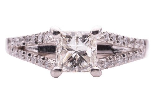 Lot 124 - A princess cut diamond ring, featuring a...