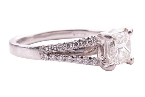 Lot 124 - A princess cut diamond ring, featuring a...