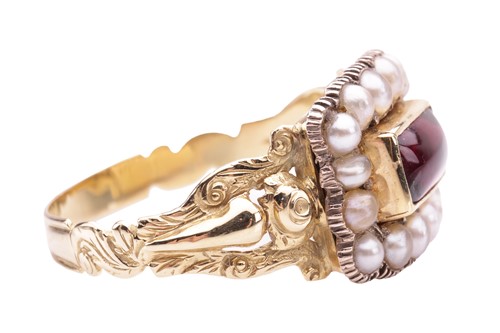 Lot 21 - A Victorian mourning ring set with garnet and...