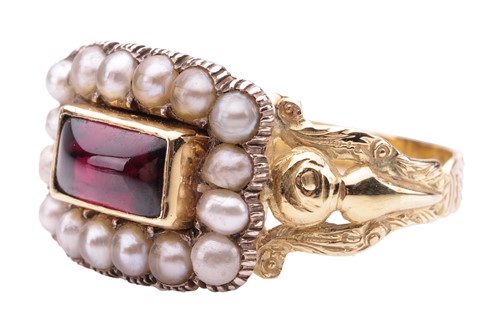 Lot 21 - A Victorian mourning ring set with garnet and...