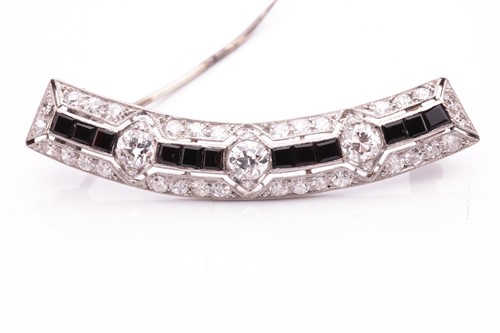 Lot 198 - An Art Deco diamond and onyx brooch, of a...